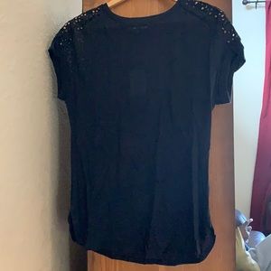 Ladies new with tags black shirt. Back laced at top of shirt